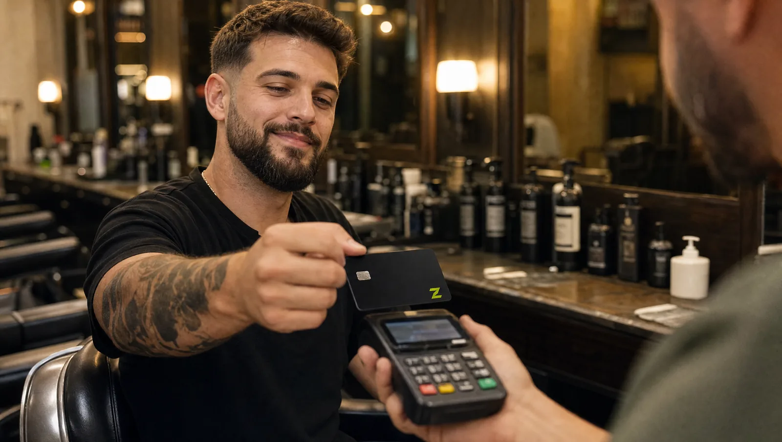 Paying a barber with the ZERA card.